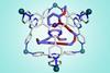 A cage-like chemical structure of hexagonal shapes holding another chemical structure inside