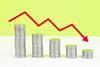 Decreasing piles of coins and red downward arrow