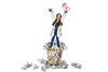 Woman on top of bin with crumpled paper
