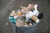 A bin-full of trash on the street of New York City