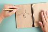 Cysteine with left handed hand holding pen