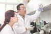 Chinese research scientists in laboratory