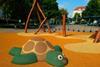 An image showing the figure of a turtle on the playground made of soft rubber crumbs