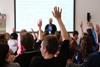 A picture showing students Raising Hands During Seminar