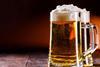 foamy glass mug of beer