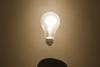 Man in bowler hat with lightbulb above head