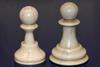 An image showing 3D printed pawns with inked scalpel lines