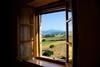 Viewing rolling farmland through a window