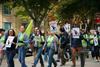 People marching in a protest with placards that say Defiance for Science