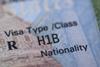 A close up of a H1B visa in a passport