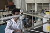 An image showing a student working inside the chemistry lab at the Simon Bolivar University campus in Caracas, Venezuela
