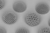 An image showing various polymeric micro-sized balls fabricated by two-photon lithography based 3D printing technology