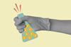 Gloved hand holding conical flask with currency signs