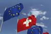 EU and Swiss flags in the wind