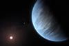 Illustration of exoplanet K2-18b from space showing a cloudy surface and its reddish star in the distance