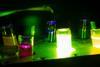 Image of photochemical vials glowing in the dark