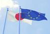 The EU and Japan flags fluttering in the wind