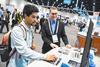Two attendees at the Pittcon conference working around around a computer