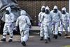 People in hazmat suits
