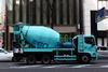A Hino Ranger cement mixer truck operated by UBE on a road in Ginza, central Tokyo, Japan/