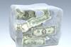 Dollar bills frozen in ice