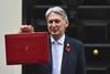 Chancellor of the Exchequer, Philip Hammond, presenting the red Budget Box, 2018