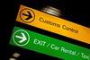 Customs control, exit, car rental and taxi sign at international airport.