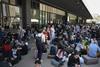 People outside Barcelona Sant rail station during a massive power cut