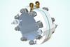 A round flat contraption with bolts around the edge of the flat faces holding a metallic plate in place