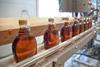An image showing bottles of maple syrup