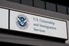 The sign on a building for the US Department of Homeland Security US Citizenship and Immigration Services