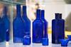 An assortment of cobalt blue glass bottles