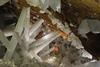Cavers climbing into a web of gypsum crystals