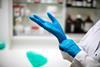 Nitrile glove being put on