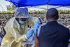 An image showing a man receiving a vaccine against Ebola