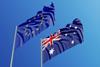 An Australian and an EU flag blowing in the wind