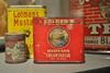 Early to mid 20th century product tins most visibly one from Folger's Golden Gate Cream Tartar, Edmonds Historical Museum, Edmonds, Washington, USA.