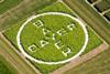 An image showing the Bayer logo letters written on a grass lawn