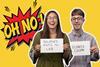 Two people holding signs on a yellow background that reads 'oh no!'