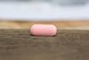 Flibanserin pill on a wooden counter