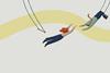 Woman letting go of trapeze to be caught by man