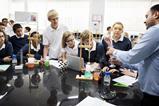 Enthralled students watch a science experiment
