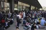 People outside Barcelona Sant rail station during a massive power cut