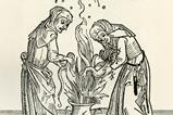 Two witches brewing a spell in a cauldron