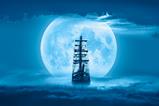 Sailing old ship in a storm sea with full moon stormy clouds in the background