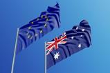 An Australian and an EU flag blowing in the wind