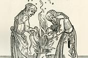 Two witches brewing a spell in a cauldron