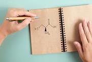 Cysteine with left handed hand holding pen