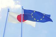The EU and Japan flags fluttering in the wind