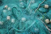 A commercial fishing net tangled with ropes and floats